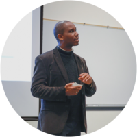 Photo of Dr. Pilgrim speaking in a classroom